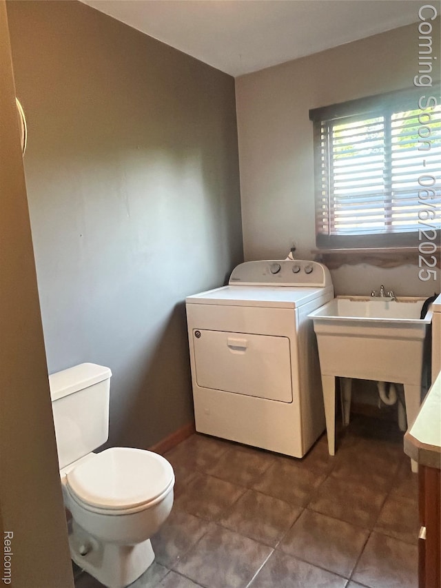 1379 Walter S Hall Dr, Lake Orion, MI 48362 - bathroom featuring washer / dryer, toilet, and tile patterned flooring