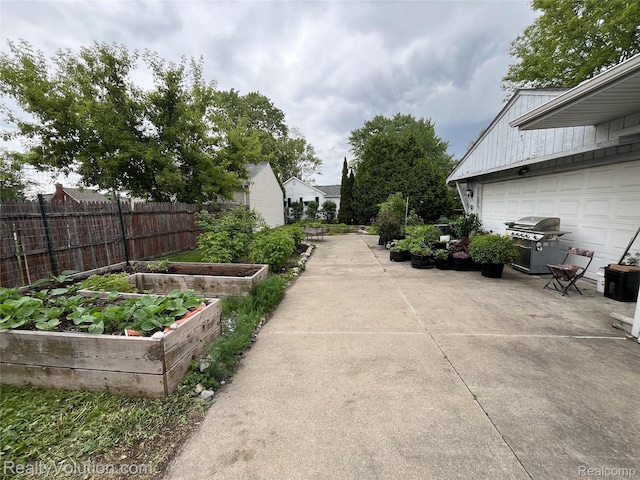 25850 Eureka Dr, Warren, MI 48091 - view of yard with a vegetable garden and a garage