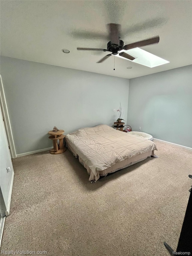 25850 Eureka Dr, Warren, MI 48091 - bedroom with a skylight, carpet flooring, baseboards, ceiling fan, and a textured ceiling