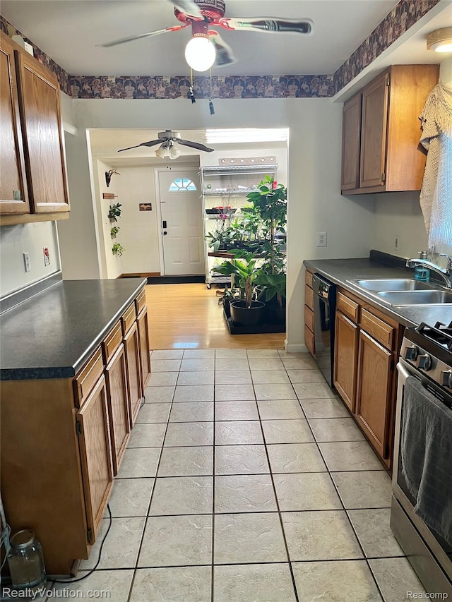 25850 Eureka Dr, Warren, MI 48091 - kitchen with a sink, dishwasher, a ceiling fan, stainless steel gas range, and light tile patterned floors