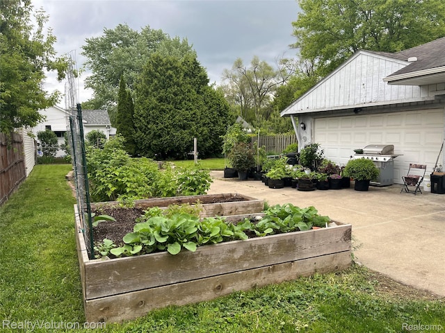 25850 Eureka Dr, Warren, MI 48091 - view of yard with a vegetable garden and a garage