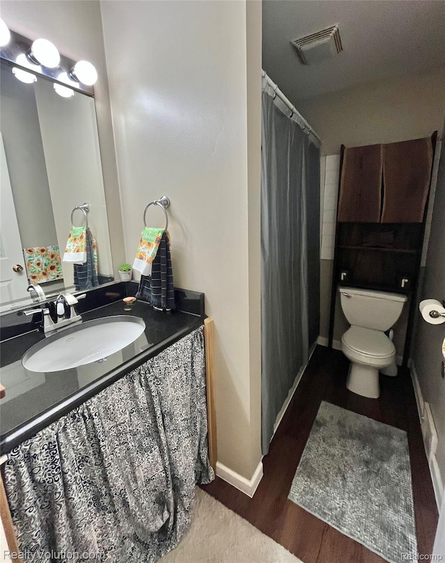 25850 Eureka Dr, Warren, MI 48091 - bathroom with toilet, vanity, a shower with shower curtain, and baseboards