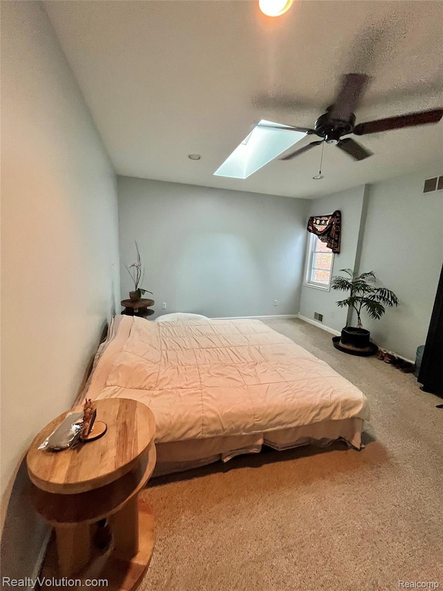 25850 Eureka Dr, Warren, MI 48091 - carpeted bedroom featuring a skylight and a ceiling fan