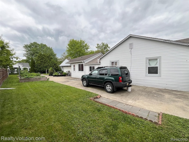 25850 Eureka Dr, Warren, MI 48091 - view of property exterior with a lawn, driveway, and a patio