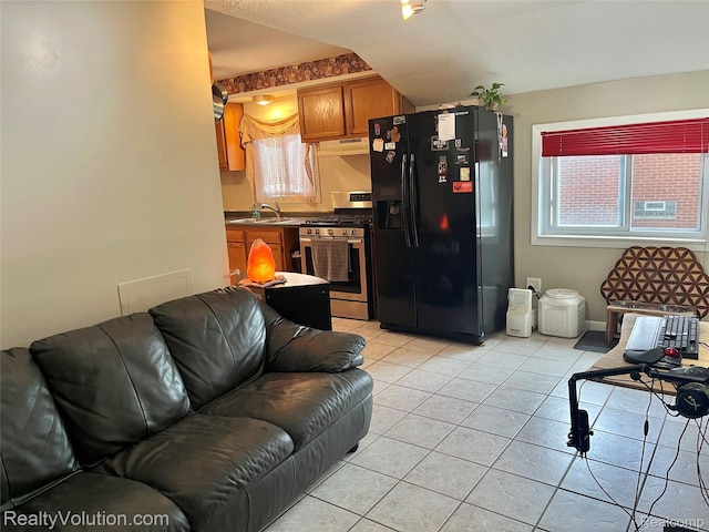 25850 Eureka Dr, Warren, MI 48091 - living area featuring light tile patterned floors, plenty of natural light, and baseboards