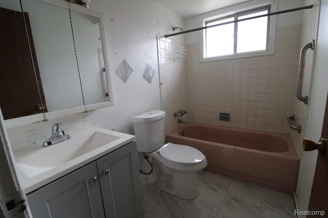 2910 Meisner Ave, Flint, MI 48506 - full bathroom featuring vanity, toilet, washtub / shower combination, and marble look tile flooring