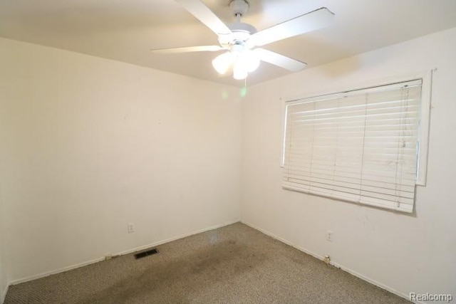 2910 Meisner Ave, Flint, MI 48506 - carpeted empty room with a ceiling fan and baseboards