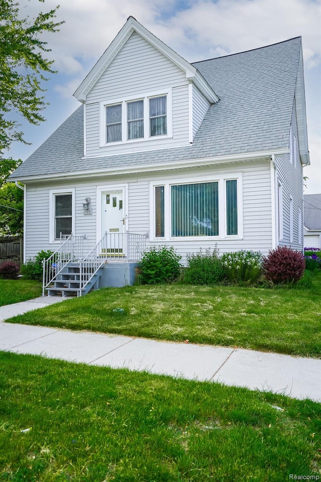 106 Hubbard St, Mount Clemens, MI 48043 - view of front facade with a shingled roof and a front yard