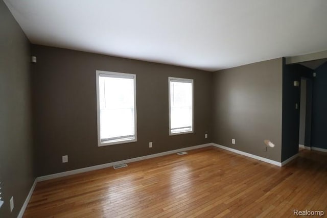 111 N Genesee St, Davison, MI 48423 - empty room with light wood-style flooring and baseboards