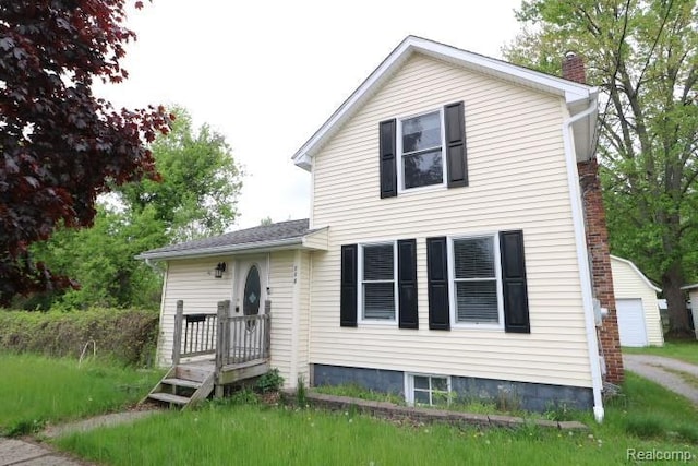 111 N Genesee St, Davison, MI 48423 - view of front of home featuring a chimney and a detached garage
