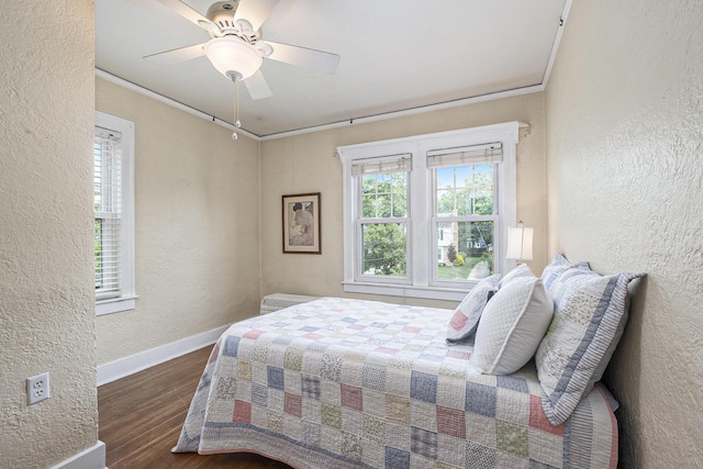 2323 Paris Ave SE, Grand Rapids, MI 49507 - bedroom with a textured wall, wood finished floors, baseboards, ceiling fan, and ornamental molding