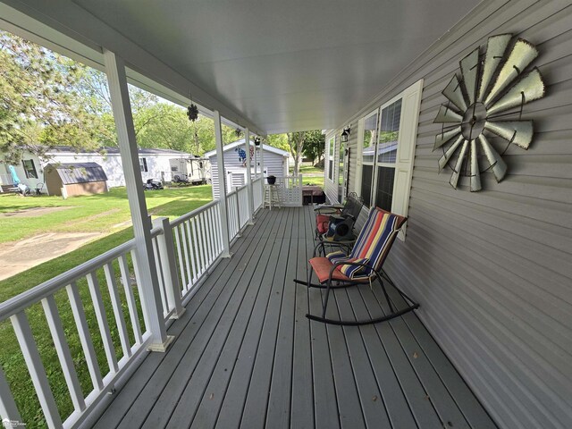 4101 S Sheridan Rd, Lennon, MI 48449 - porch with a yard and an outbuilding