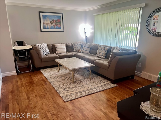 28447 Patricia Ave, Warren, MI 48092 - living room featuring hardwood / wood-style floors, crown molding, and baseboards