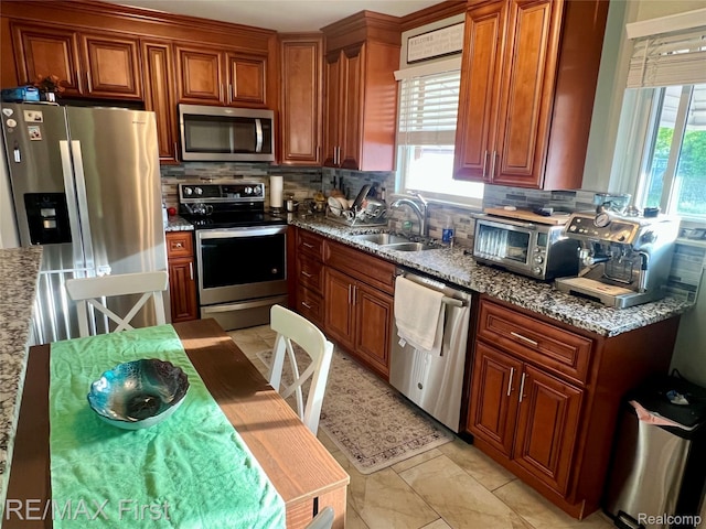 28447 Patricia Ave, Warren, MI 48092 - kitchen with appliances with stainless steel finishes, a sink, decorative backsplash, and healthy amount of natural light
