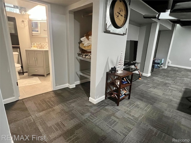 28447 Patricia Ave, Warren, MI 48092 - basement featuring dark carpet and baseboards