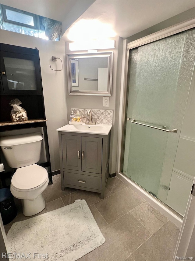 28447 Patricia Ave, Warren, MI 48092 - bathroom featuring toilet, vanity, and a stall shower