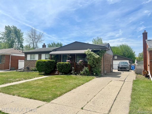 28447 Patricia Ave, Warren, MI 48092 - view of front of property featuring brick siding, covered porch, and a front lawn