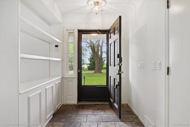 58540 Grand River Ave, New Hudson, MI 48165 - entrance foyer with stone tile flooring and baseboards