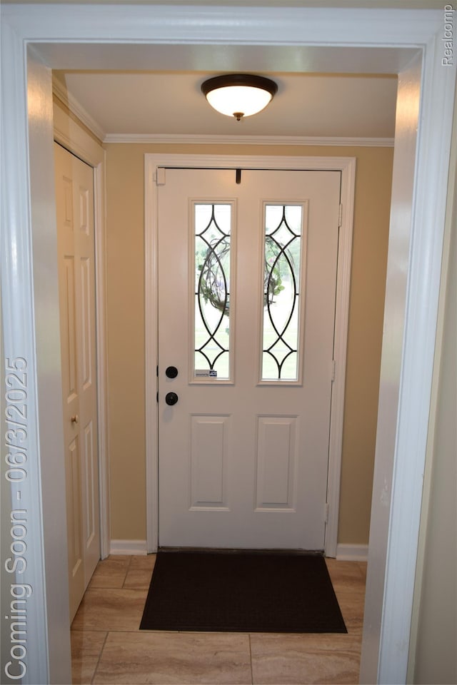 7448 Miller Rd, Swartz Creek, MI 48473 - foyer entrance with ornamental molding, light wood-type flooring, and baseboards