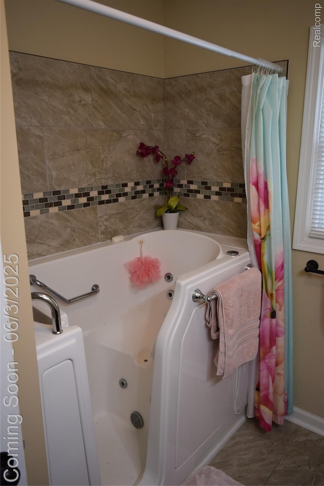 7448 Miller Rd, Swartz Creek, MI 48473 - bathroom featuring a tub with jets