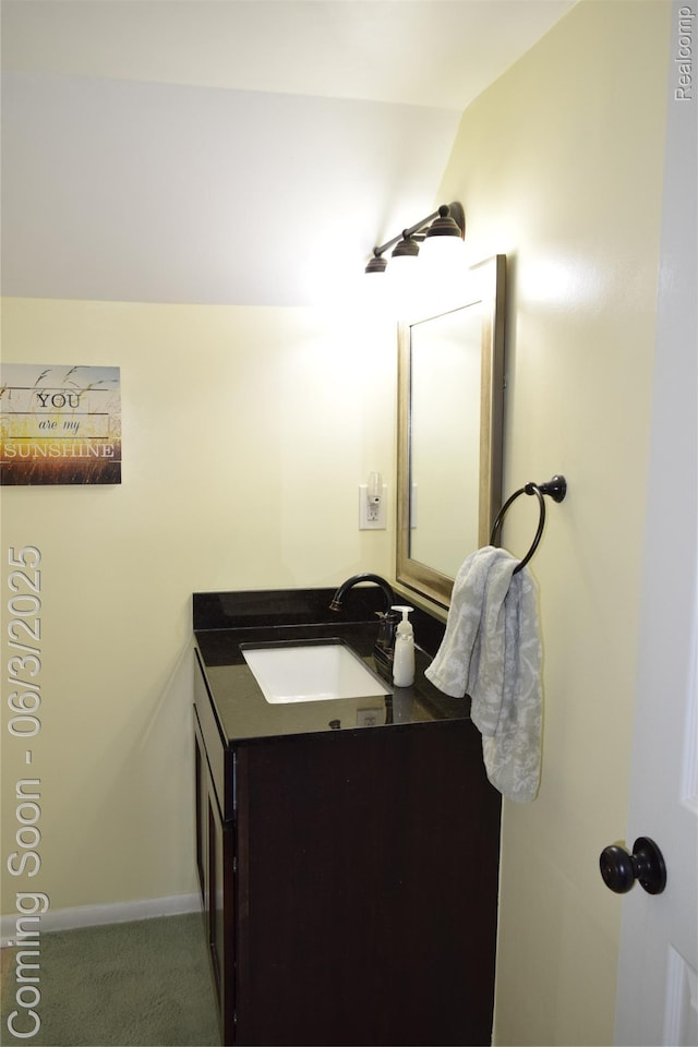 7448 Miller Rd, Swartz Creek, MI 48473 - bathroom with vanity and vaulted ceiling
