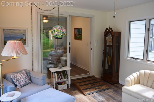 7448 Miller Rd, Swartz Creek, MI 48473 - living area featuring wood finished floors, healthy amount of natural light, and baseboards