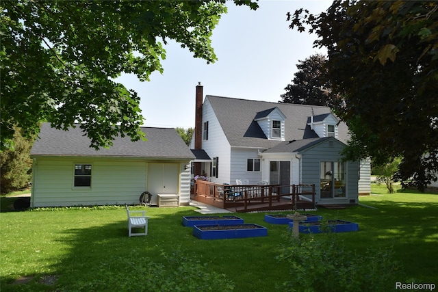 7448 Miller Rd, Swartz Creek, MI 48473 - back of property featuring a deck, a lawn, and a chimney