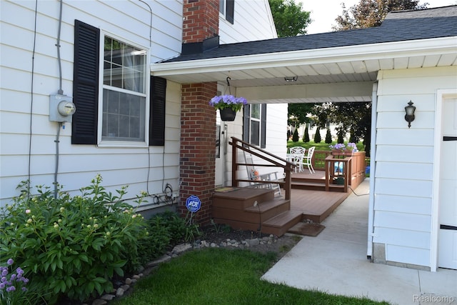 7448 Miller Rd, Swartz Creek, MI 48473 - entrance to property featuring a shingled roof and a porch