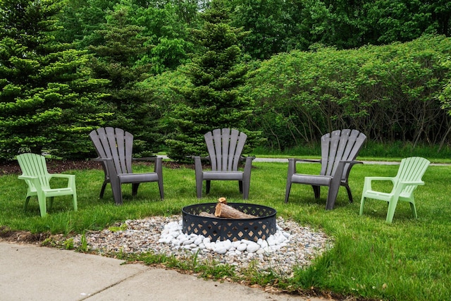 2928 Heeney Rd, Stockbridge, MI 49285 - view of green lawn with a fire pit