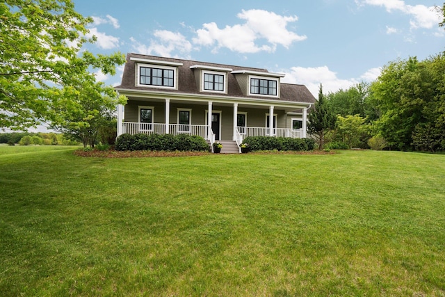 2928 Heeney Rd, Stockbridge, MI 49285 - view of front facade with a front lawn and covered porch