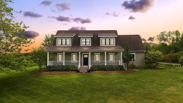 2928 Heeney Rd, Stockbridge, MI 49285 - view of front facade featuring a front yard, covered porch, and a shingled roof