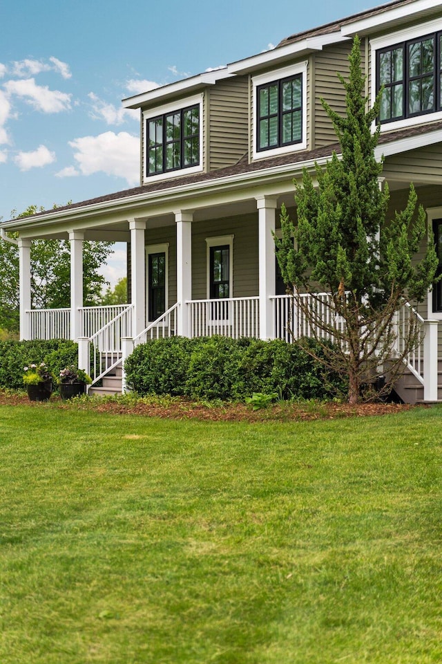 2928 Heeney Rd, Stockbridge, MI 49285 - farmhouse-style home with a front yard and a porch