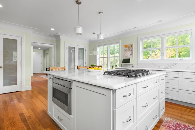2928 Heeney Rd, Stockbridge, MI 49285 - kitchen with french doors, appliances with stainless steel finishes, white cabinetry, light stone countertops, and recessed lighting
