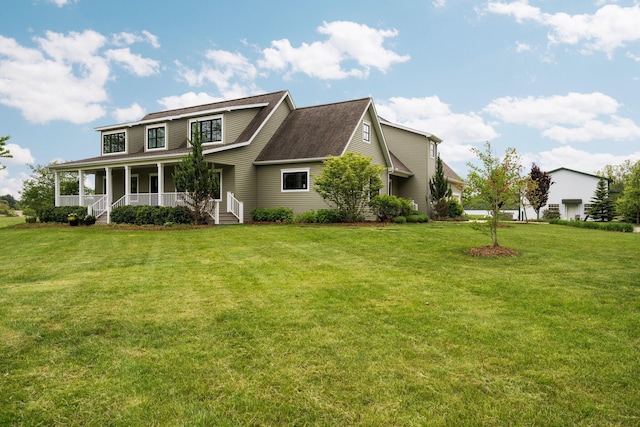 2928 Heeney Rd, Stockbridge, MI 49285 - view of front facade featuring covered porch and a front lawn