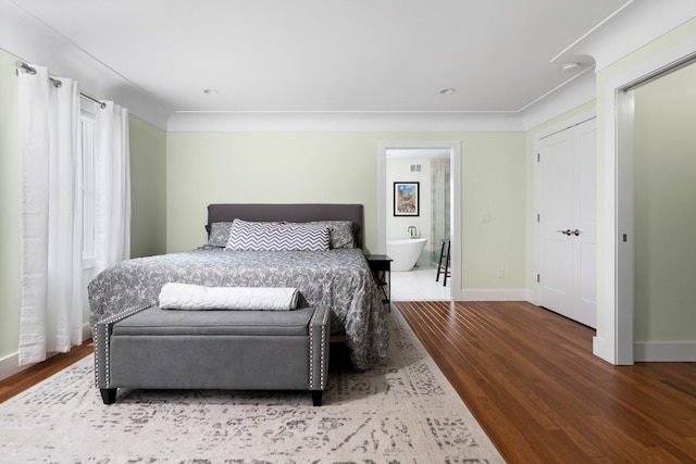 2928 Heeney Rd, Stockbridge, MI 49285 - bedroom with wood finished floors and baseboards