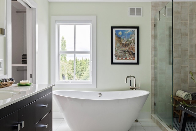 2928 Heeney Rd, Stockbridge, MI 49285 - full bath with a soaking tub, vanity, tile patterned flooring, and a stall shower