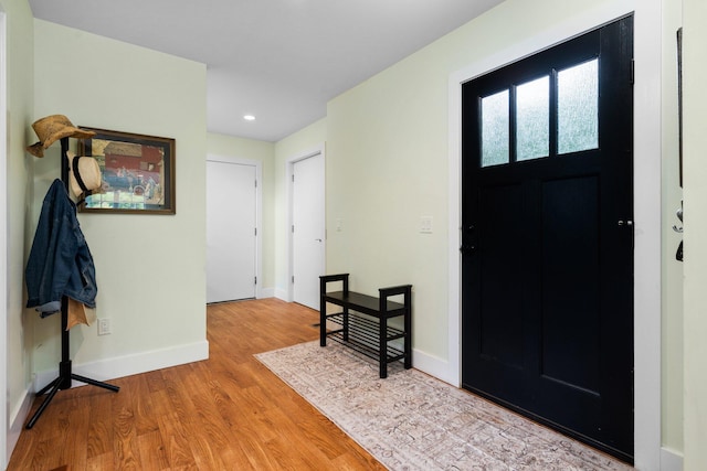 2928 Heeney Rd, Stockbridge, MI 49285 - entrance foyer featuring baseboards, wood finished floors, and recessed lighting