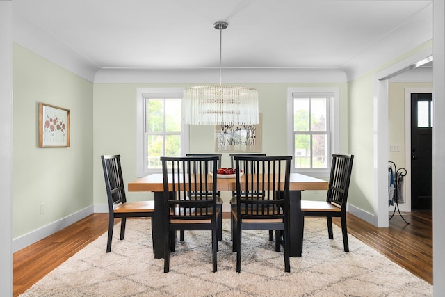 2928 Heeney Rd, Stockbridge, MI 49285 - dining room featuring a chandelier, wood finished floors, and baseboards