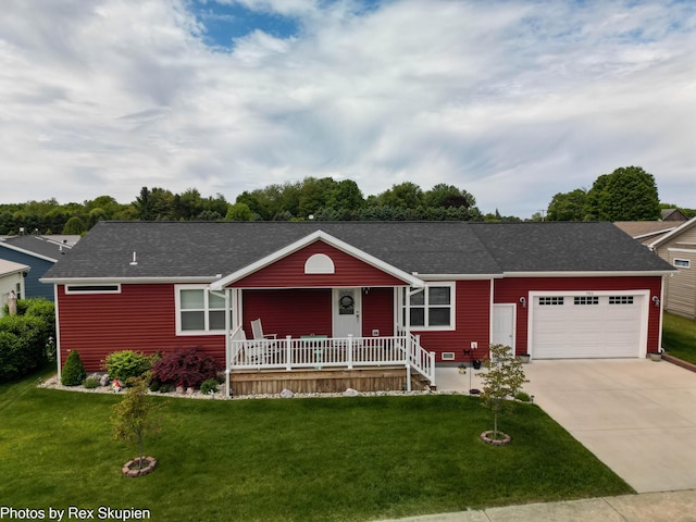 701 Knollcrest Ln, Fremont, MI 49412 - ranch-style house featuring a porch, a garage, concrete driveway, and a front yard
