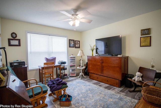 701 Knollcrest Ln, Fremont, MI 49412 - sitting room with a ceiling fan, wood finished floors, and an office area