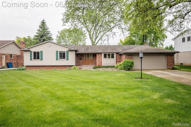 12950 Via Catherina Dr, Grand Blanc, MI 48439 - ranch-style home featuring brick siding, a garage, concrete driveway, and a front yard