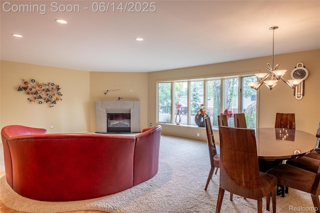 12950 Via Catherina Dr, Grand Blanc, MI 48439 - carpeted living room featuring a chandelier, a glass covered fireplace, and recessed lighting