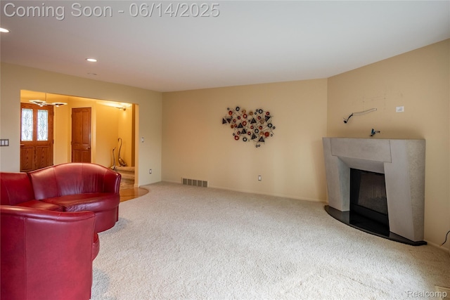12950 Via Catherina Dr, Grand Blanc, MI 48439 - carpeted living area with a glass covered fireplace and recessed lighting