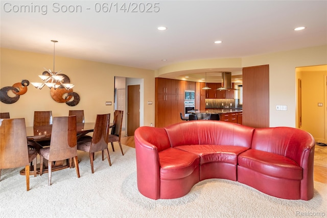 12950 Via Catherina Dr, Grand Blanc, MI 48439 - living room with a chandelier, recessed lighting, and light carpet