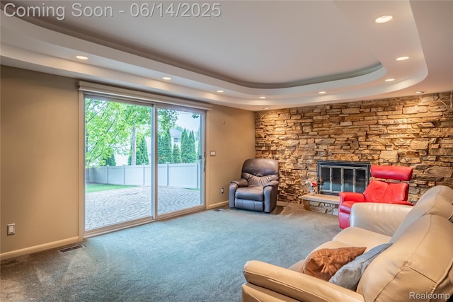 12950 Via Catherina Dr, Grand Blanc, MI 48439 - carpeted living area featuring recessed lighting, a fireplace, and a tray ceiling