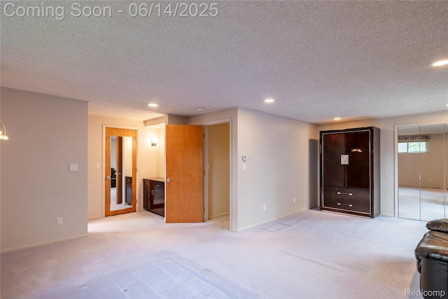 12950 Via Catherina Dr, Grand Blanc, MI 48439 - unfurnished living room with a textured ceiling, light colored carpet, and recessed lighting