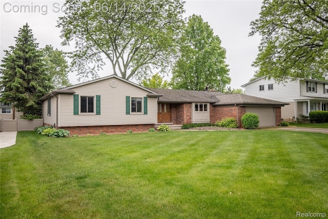 12950 Via Catherina Dr, Grand Blanc, MI 48439 - view of front of property with driveway, a garage, and brick siding