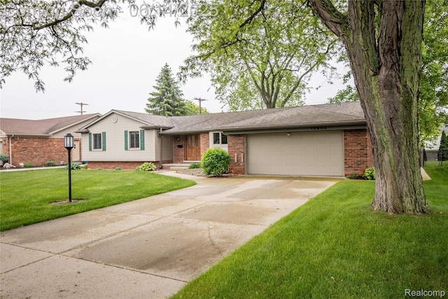 12950 Via Catherina Dr, Grand Blanc, MI 48439 - view of front of property featuring an attached garage, brick siding, concrete driveway, and a front yard