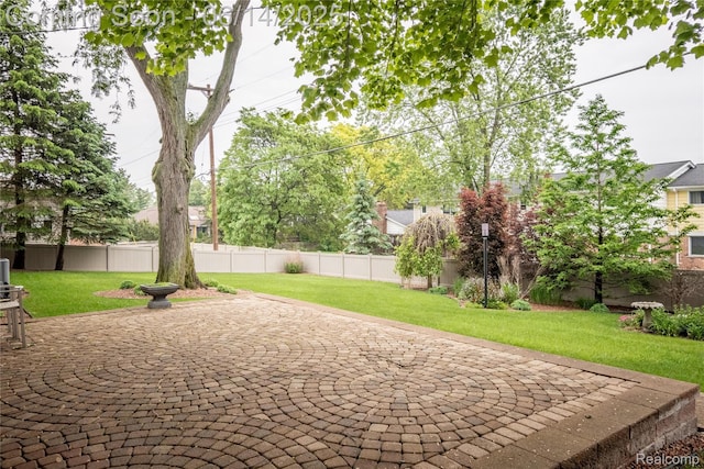 12950 Via Catherina Dr, Grand Blanc, MI 48439 - fenced backyard with a patio area