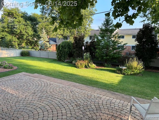 12950 Via Catherina Dr, Grand Blanc, MI 48439 - fenced backyard featuring a patio